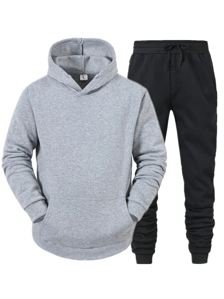 Gray fleece hoodie and black jogger set for men, offering trendy style and comfort. Ideal for sport and leisure wear.