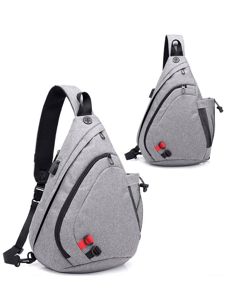 Gray men's waterproof crossbody bag, barrel-shaped with multiple pockets and zipper closure, perfect for outdoor adventures.