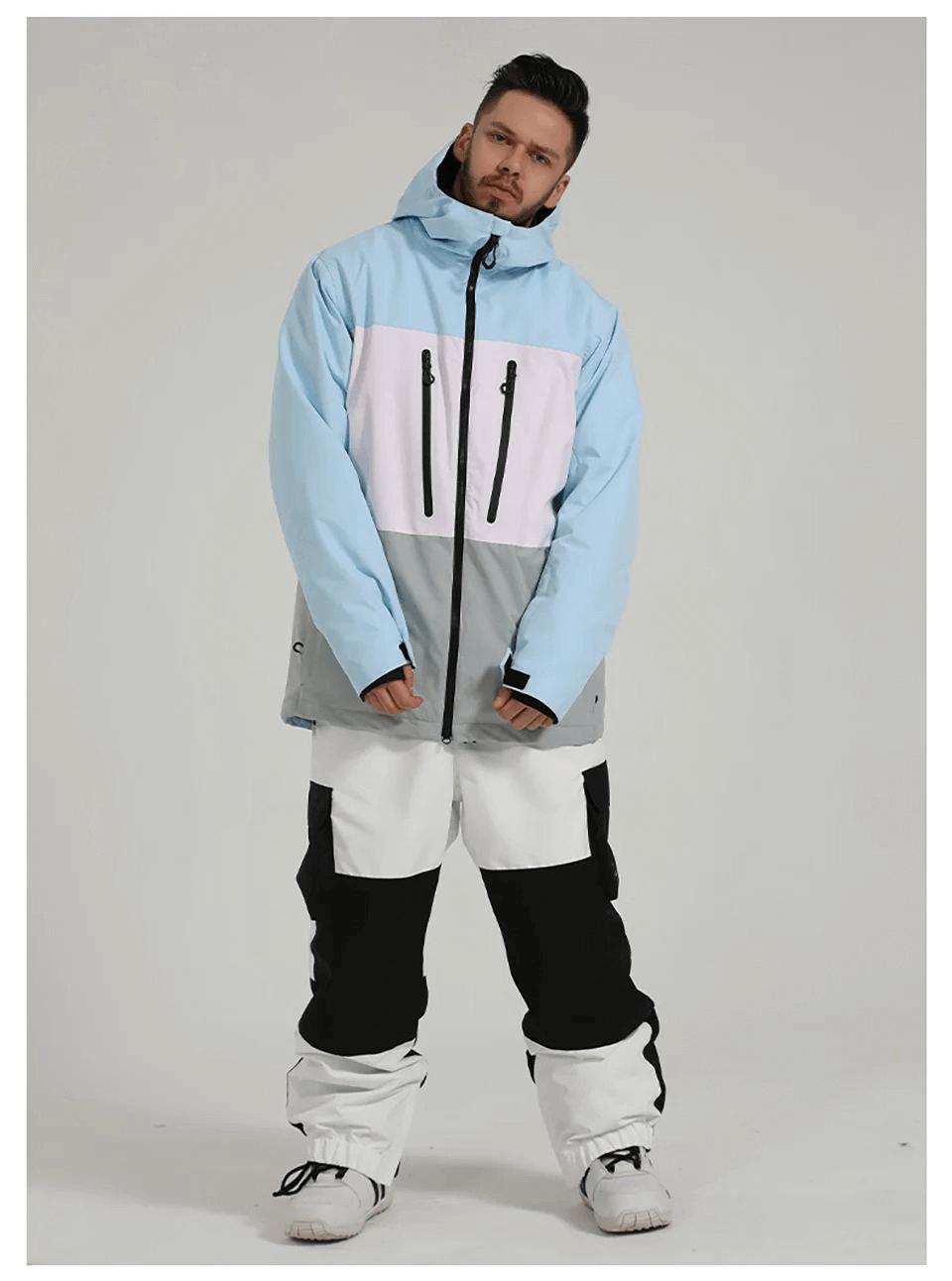 Man wearing SF2059 Men's Waterproof Jacket and Pants for snow sports. Featuring bright neon and durable, breathable fabric.