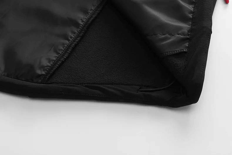 Close-up of black waterproof softshell jacket lining, highlighting the windproof fabric of men's performance sportswear SF2063.