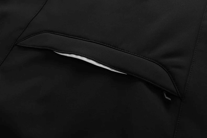 Close-up of black pocket on Men's Waterproof Softshell Jacket SF2063 highlighting windproof and outdoor performance features.
