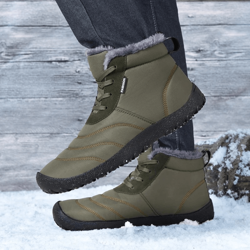Man wearing Men's Winter Ankle Snow Boots, split leather, plush lining, rubber outsole for grip, in snow. SF2026.