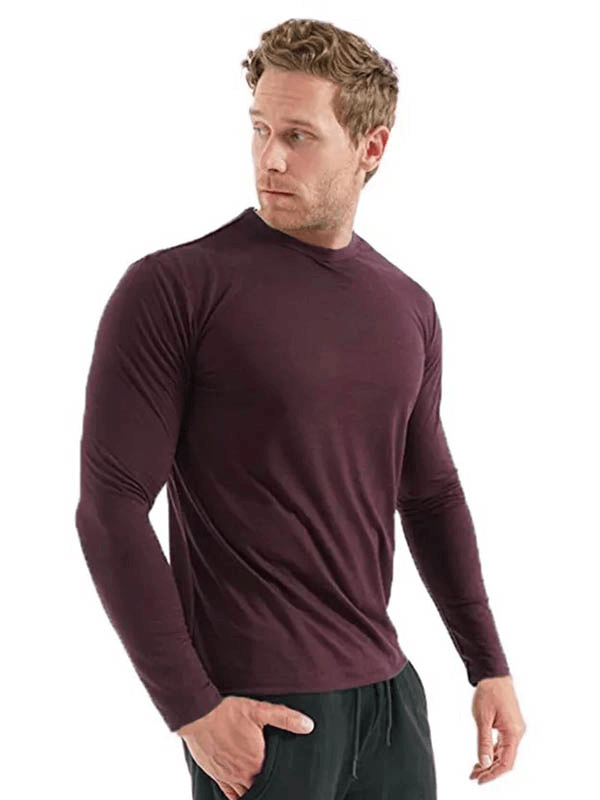 Man wearing Merino Wool Thermal Long Sleeves Top in maroon, provides warmth and breathability, perfect for men's winter wear - SF1808