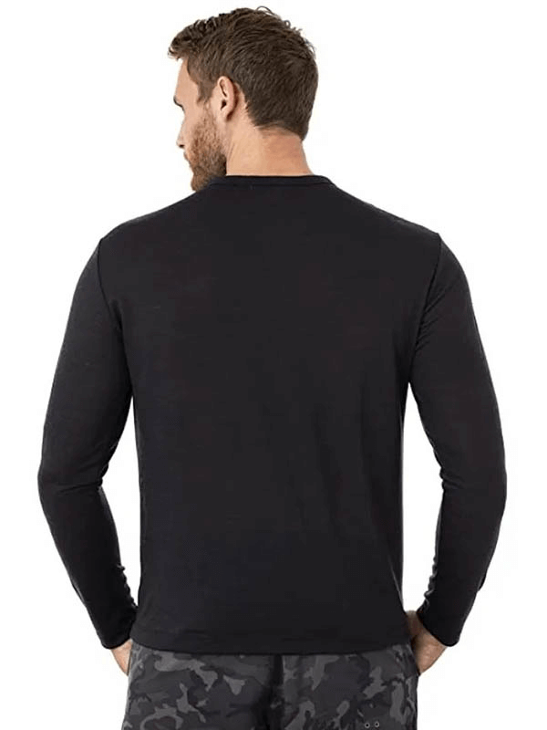 Back view of man wearing black Merino Wool Thermal Long Sleeves Top SF1808, showcasing solid design and full-length sleeves.