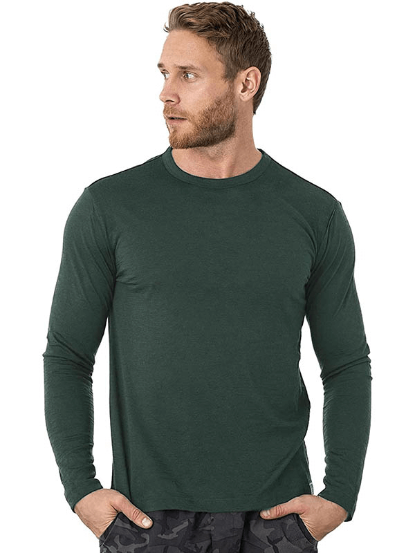 Man modeling Merino Wool Thermal Long Sleeves Top in green, perfect for warmth and style.