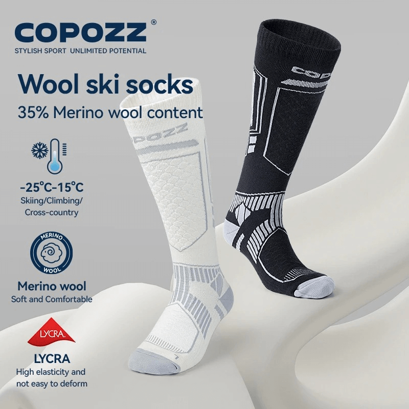 Merino wool ski socks for skiing and hiking, shown in black and white, designed for warmth and comfort in winter sports.