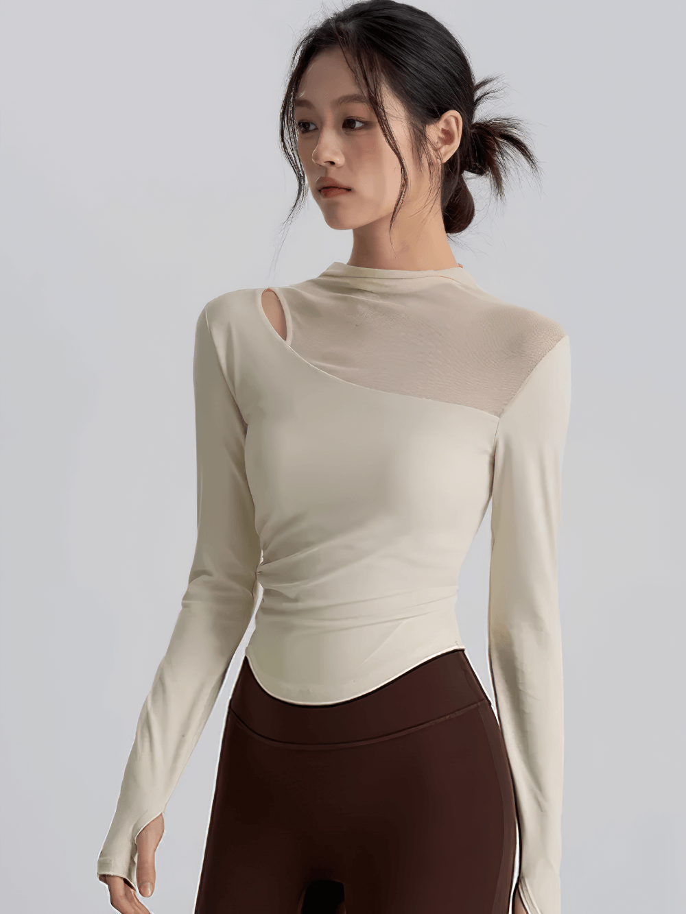 Model wearing Mesh Back Long Sleeve Yoga Top with Chest Pad - SF4216, showcasing stylish design with mesh back and long sleeves.