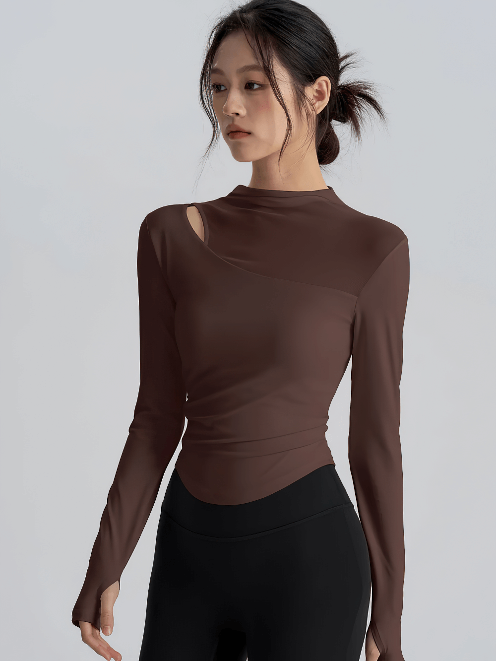 Woman wearing Mesh Back Long Sleeve Yoga Top with Chest Pad - SF4216, showcasing sleek athletic style.