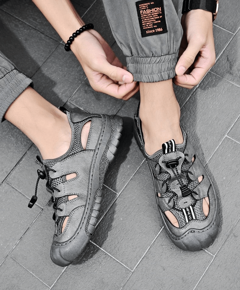 Mesh breathable men's sandals with flexible sole, SF1417, showcasing stylish design and comfort, featuring hook and loop closure on grey floor.