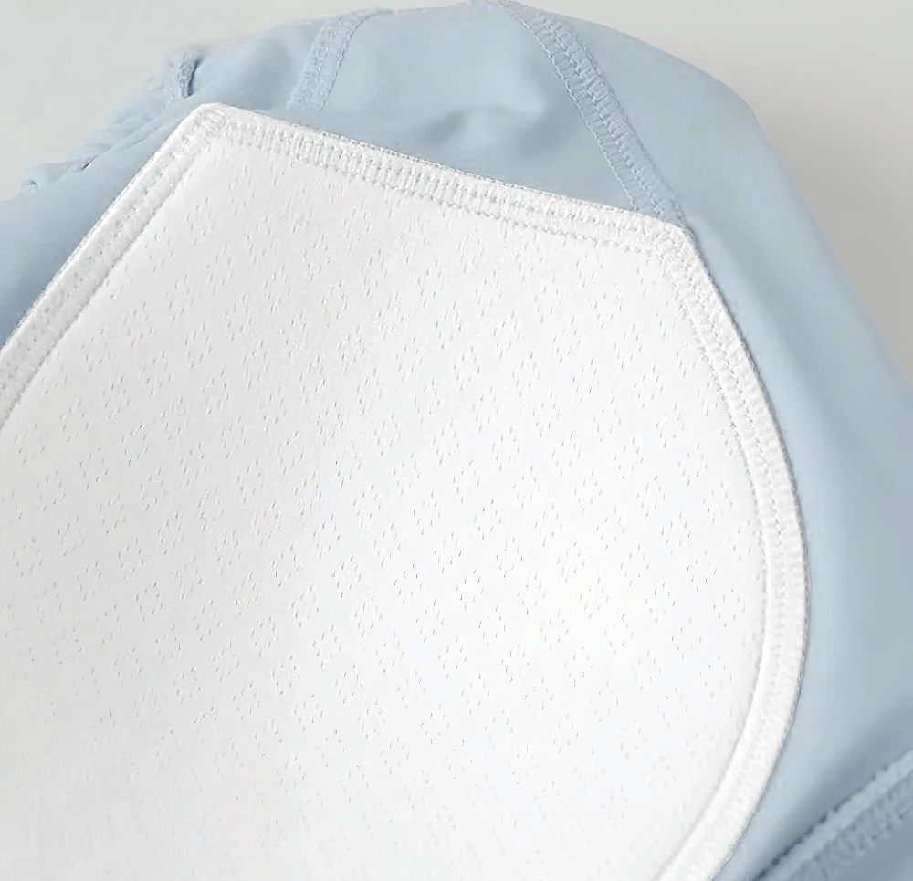 Alt Tag: Mesh Mock Neck Sports Crop Top with Built-In Bra - SF4374 sky blue quick-dry fabric close-up with breathable built-in bra pad