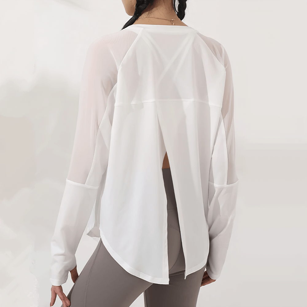 Back view of white mesh panel long sleeve yoga top for women, featuring a stylish forked back design perfect for workouts.