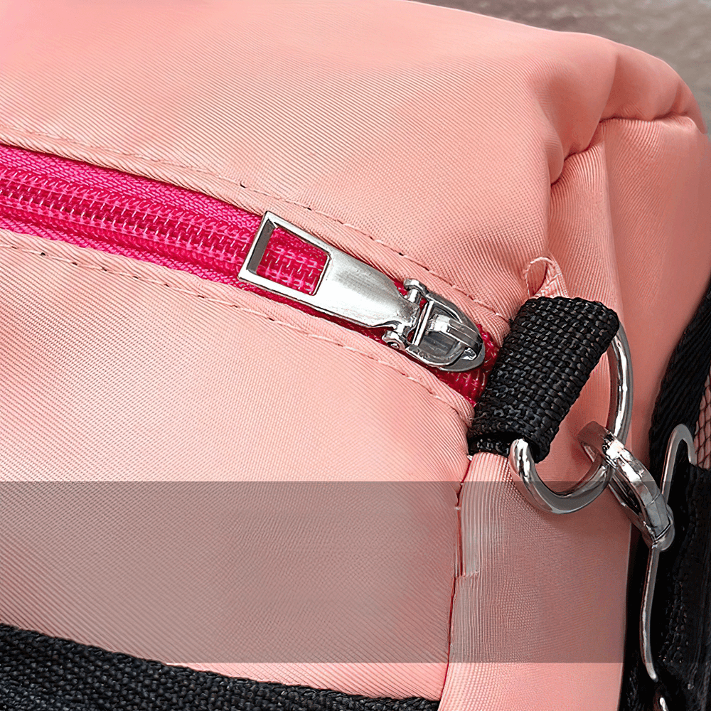 Close-up of pink mesh panel sports duffel bag SF2654 showing durable pink zipper and sturdy D-ring for adjustable strap.