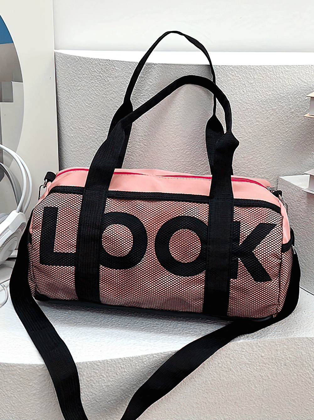 Pink Mesh Panel Sports Duffel Bag with 'LOOK' design and black handles, featuring spacious storage for gym or travel essentials.