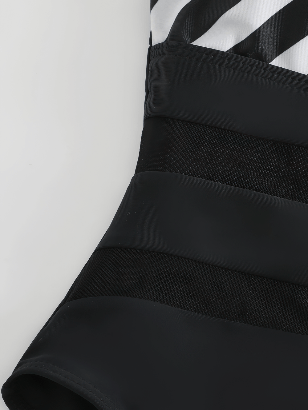 Close-up of the Mesh Panel Striped Halter One Piece Swimsuit - SF4587 showcasing mesh waist panels and striped design.