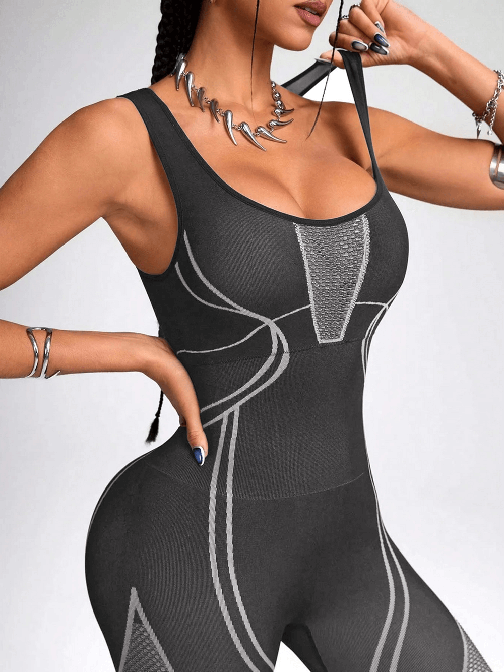 Woman wearing Mesh Panel Yoga Jumpsuit with Sculpt Fit Design - SF4229, perfect for gym workouts and yoga training.