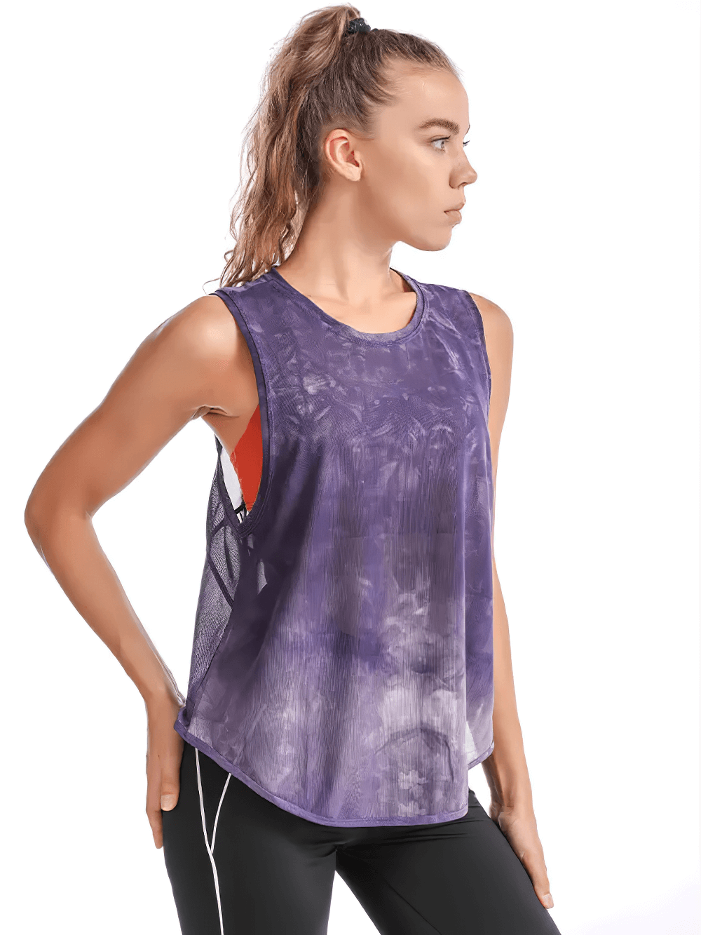 Woman wearing a purple mesh sleeveless yoga tank top, perfect for active workouts like yoga and running. Stylish and breathable design.