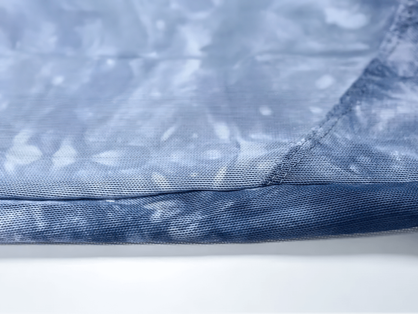 Close-up of breathable mesh fabric on a women's sleeveless yoga tank top, perfect for active workouts and fitness.