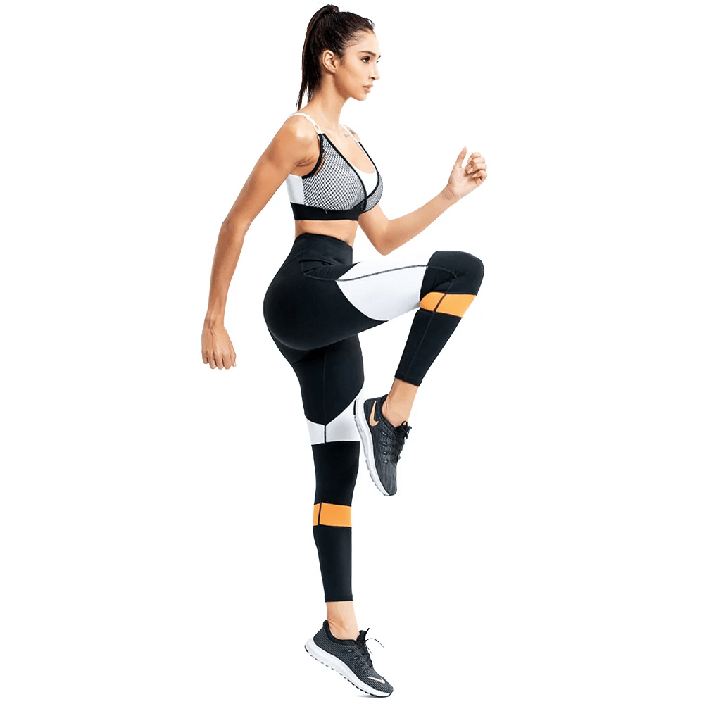 Woman wearing a beige mesh sports bra and colorblock leggings, ideal for yoga and running. Chic activewear for women SF2124.