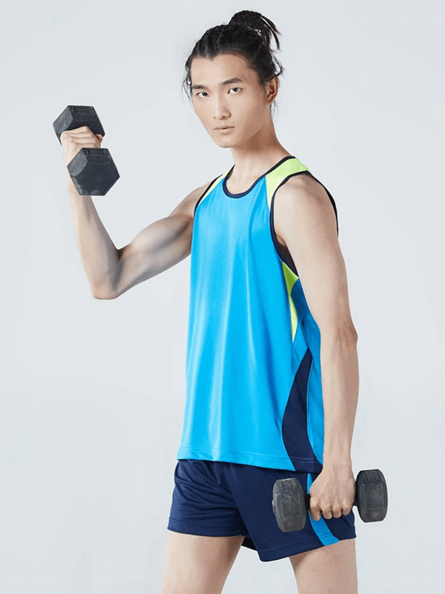 Man wearing Men's Athletic Mesh Tank Top and Shorts Set, exercising with dumbbells in blue activewear, ideal for running and gym.