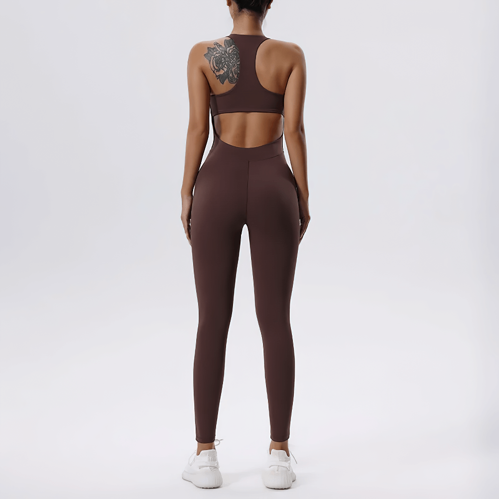 Back view of a woman wearing a brown sleeveless zip-front fitness jumpsuit, perfect for gym and casual outings.