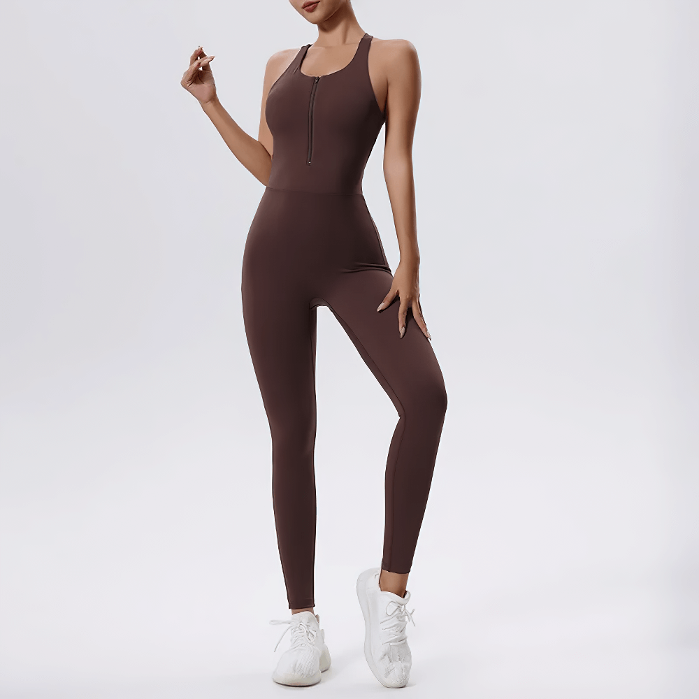 Brown sleeveless women's zip-front fitness jumpsuit SF2095, perfect for workouts or casual outings, paired with white trainers.