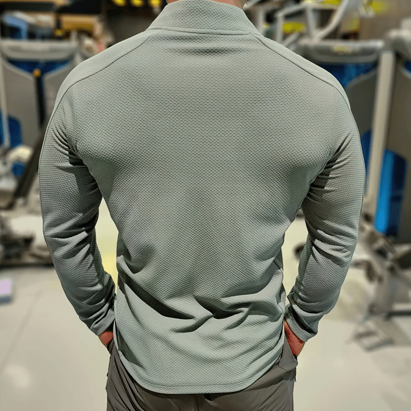 Back view of a modern zip-up textured sports jacket in light gray, showcasing breathable material and O-neck design; perfect for exercise.