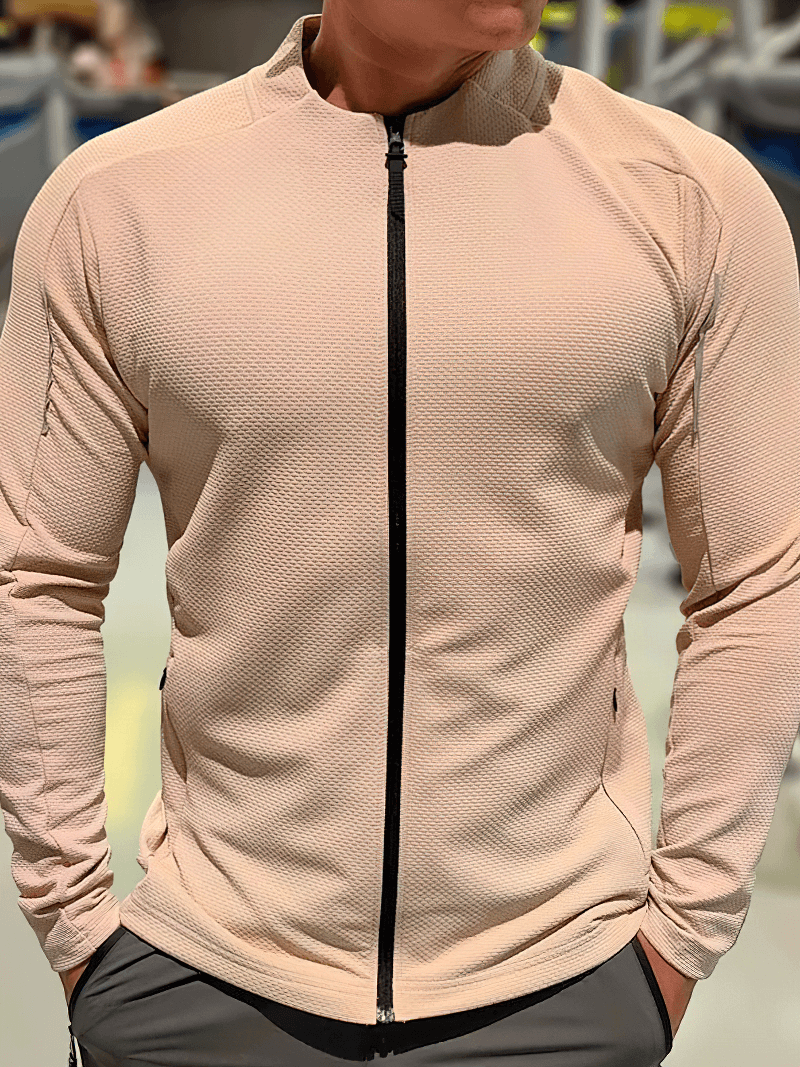 Modern men's zip-up textured sports jacket with pockets, designed for running, featuring breathable fabric and quick-dry technology.