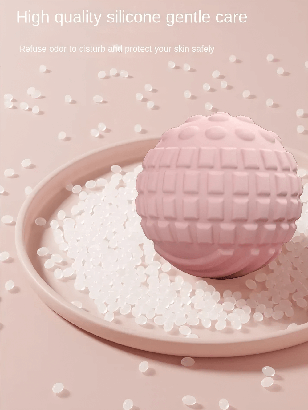 Soft pink massage ball on a plate with silicone beads, highlighting gentle care and odor-free protection for skin.
