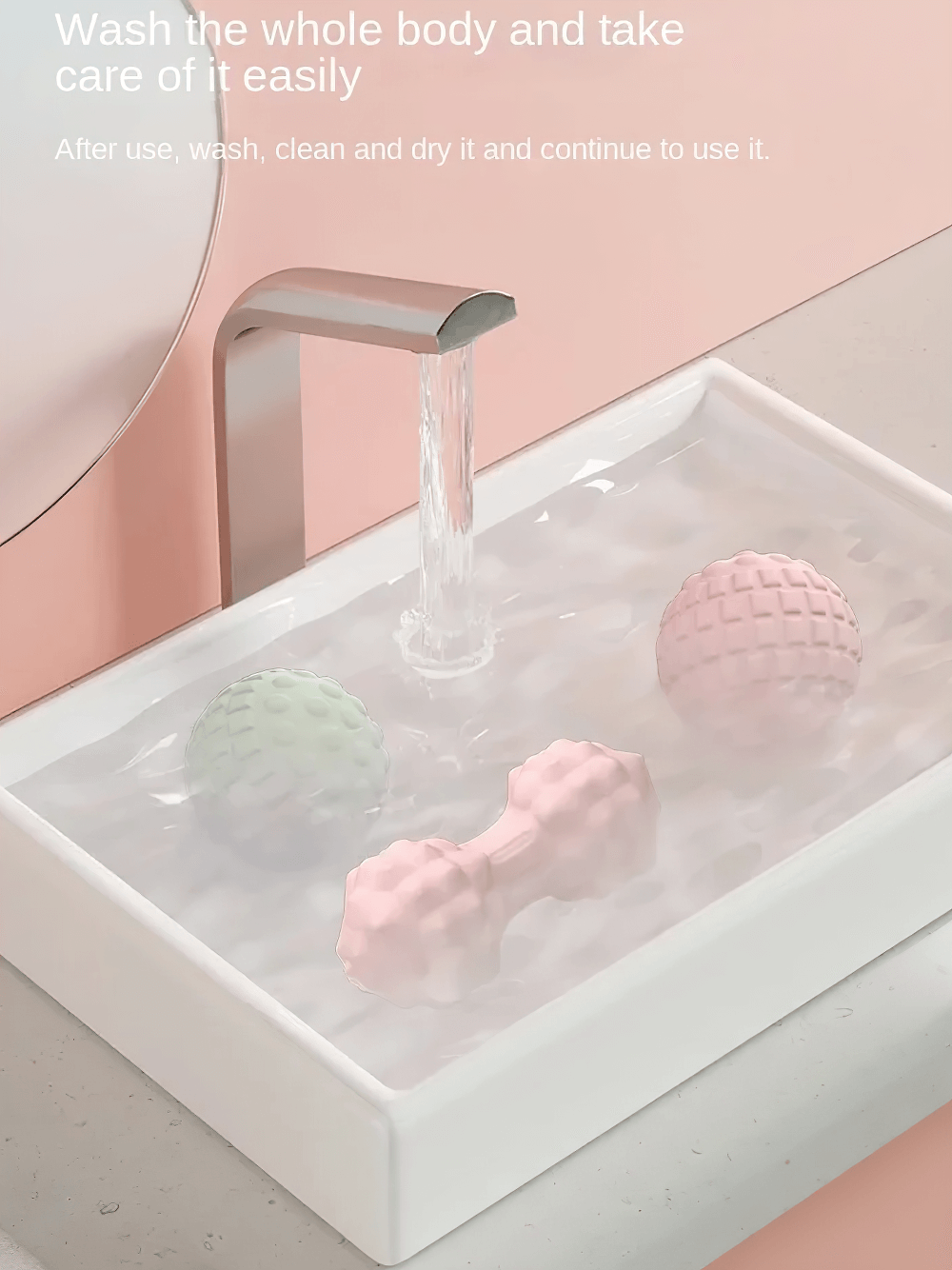 Multi-color massage balls being washed in a sink for easy cleaning and maintenance. Perfect for muscle relief and relaxation exercises.