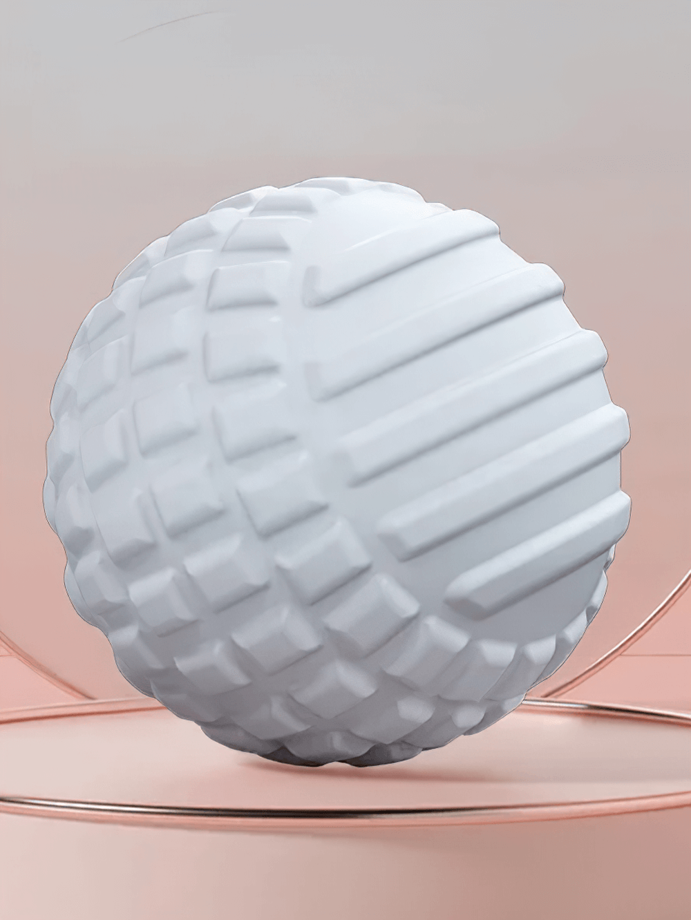 Textured white massage ball for muscle relief against a pink gradient background.