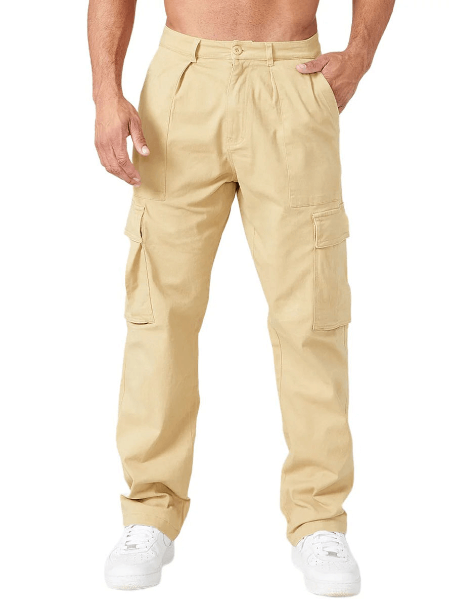 Man wearing beige multi-pocket training cargo trousers, showcasing comfortable, durable design with multiple pockets and full-length coverage.
