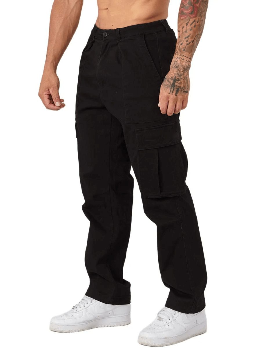 Men's black multi-pocket training cargo trousers SF1921, full-length design, styled with white sneakers.