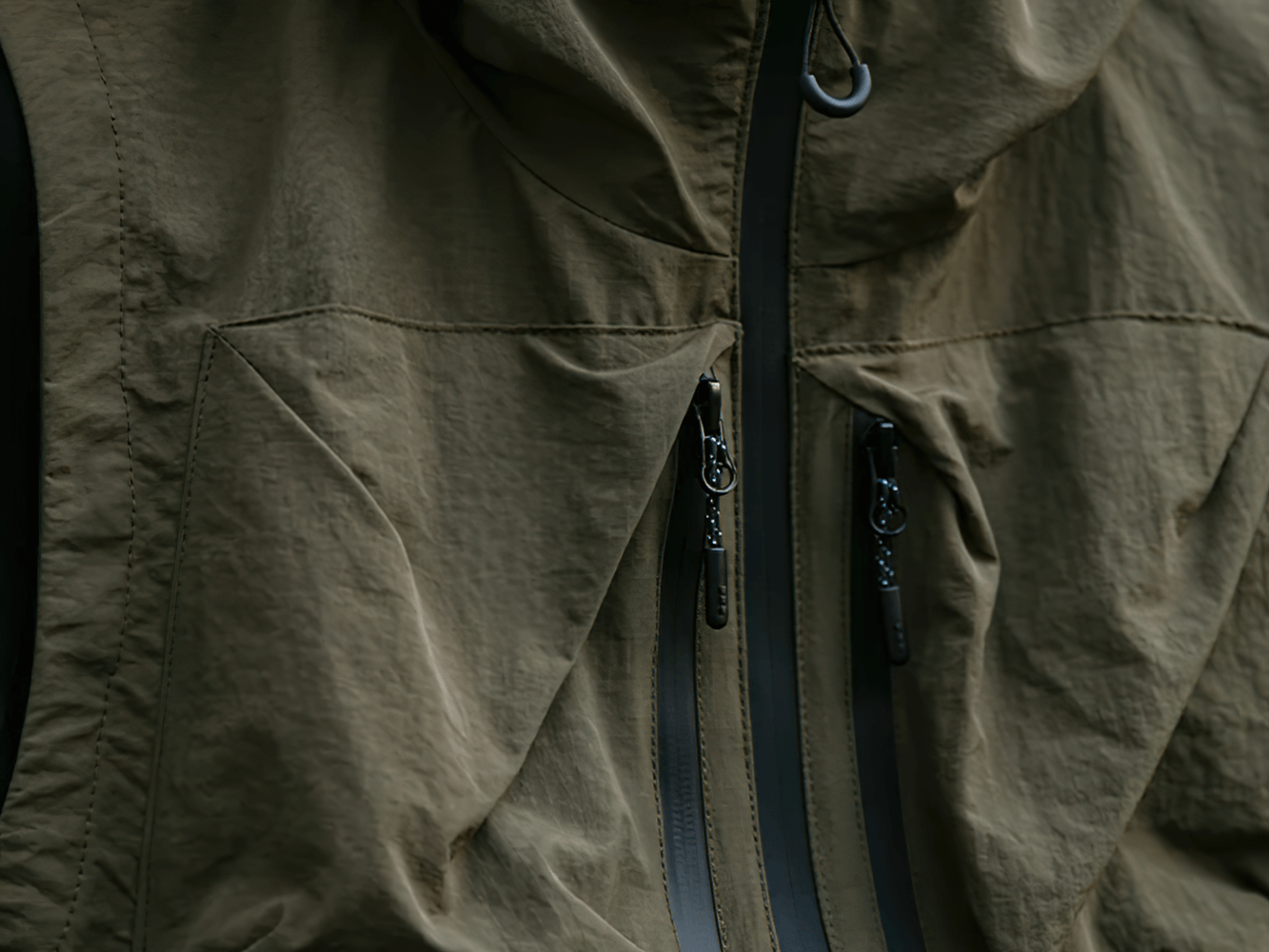 Close-up of multi-pocket waterproof cargo vest with hood, showcasing durable nylon fabric and stylish outdoor design, SF2279.