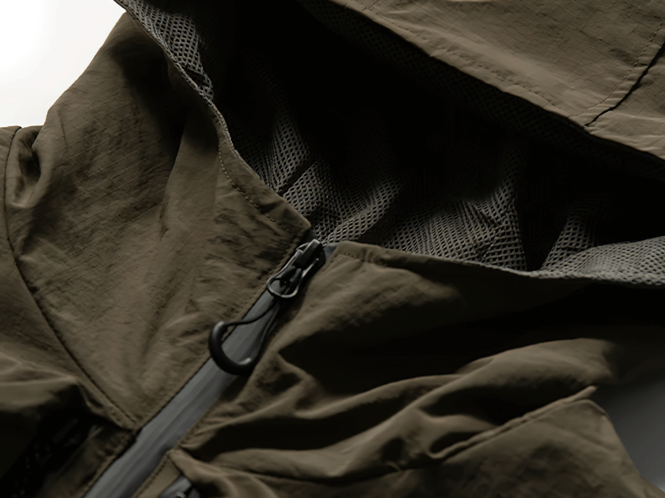 Close-up of multi-pocket waterproof cargo vest with hood, showcasing durable nylon fabric, wind-resistant features, and stylish design.