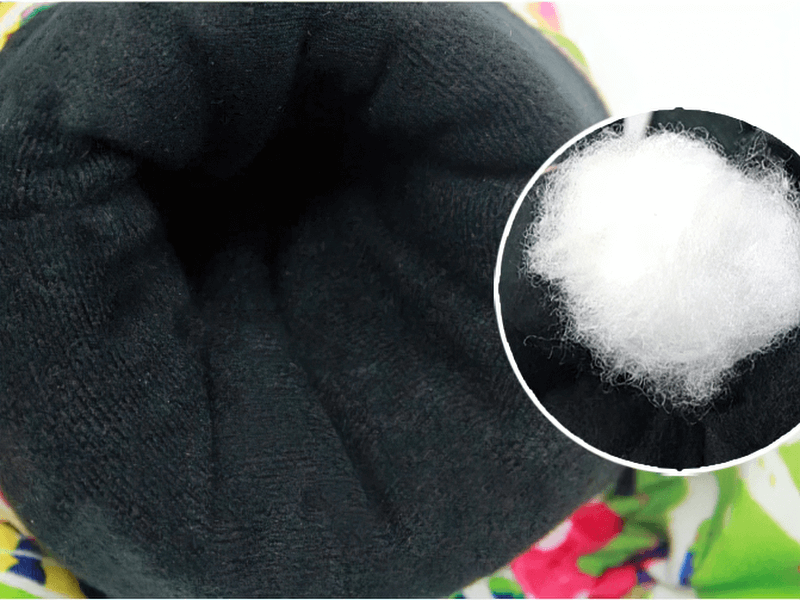 Close-up of warm, soft interior lining and padding in multicolor waterproof snowboarding gloves.