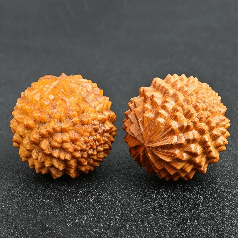 Natural wooden hand massage balls for stress relief and circulation, crafted from pine. Ideal for relaxation, yoga, and hand therapy.