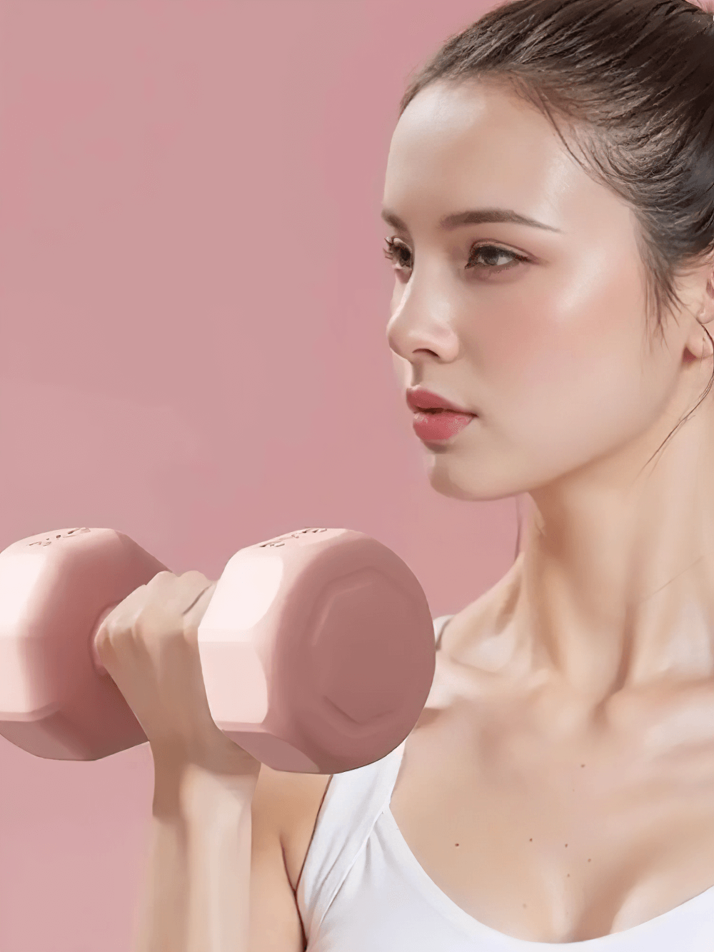 Woman lifting neoprene-coated hex dumbbell SF3347, perfect for home and gym strength training in pink.