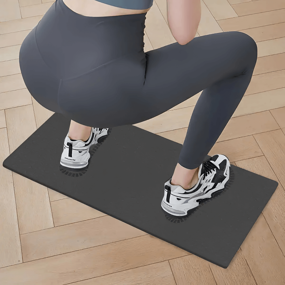 Non-slip fitness mat SF3408 for yoga and squats, showing a person in athletic gear performing a squat on wooden floor.