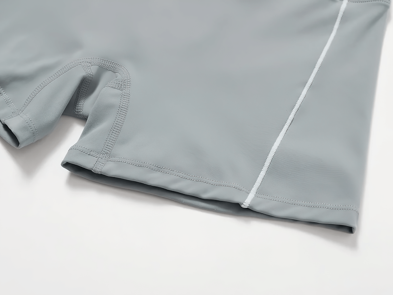 Close-up of gray nylon yoga shorts from 2pcs set, featuring breathable and quick-dry fabric, ideal for running and fitness.