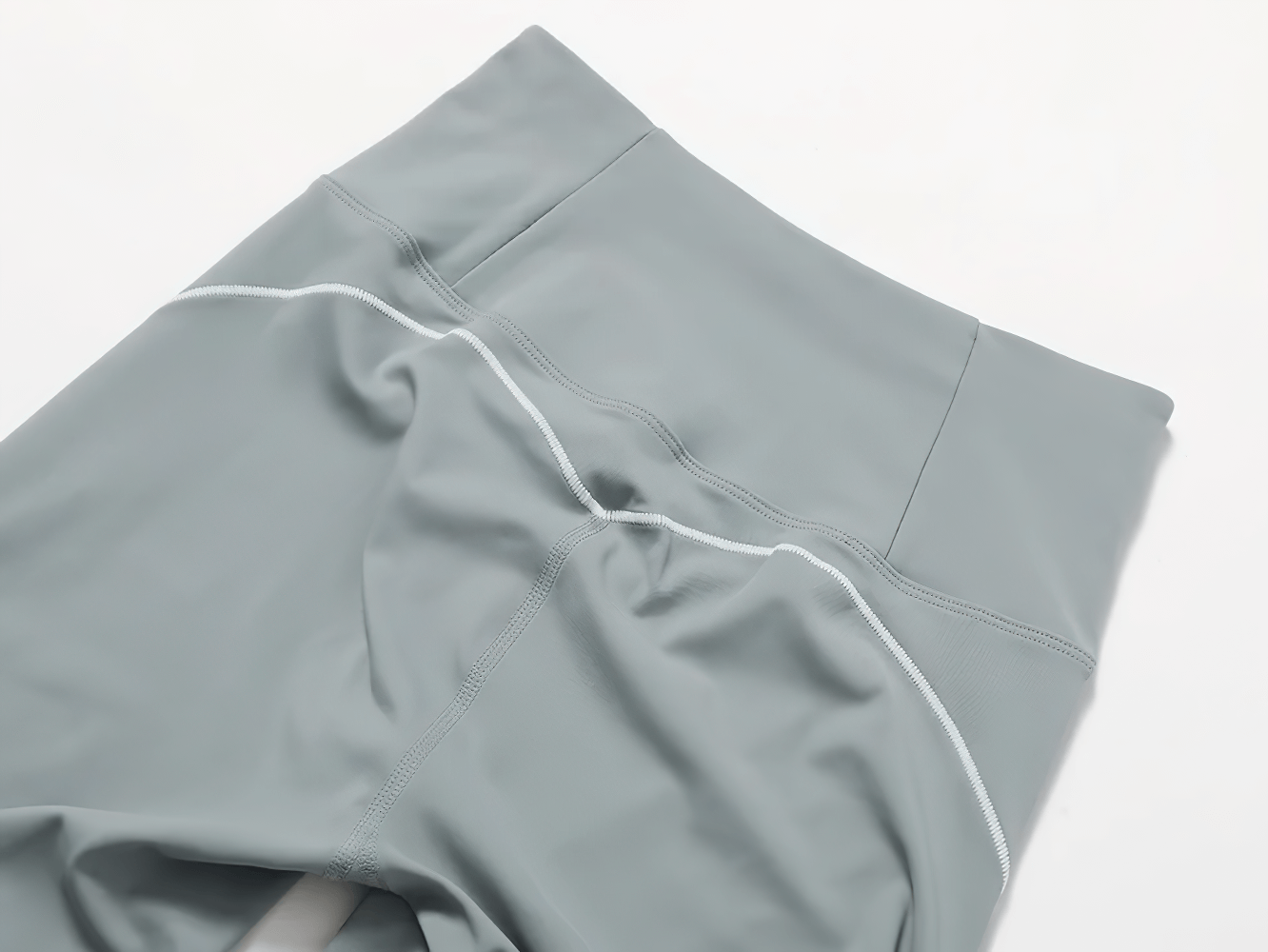 Close-up of high-waisted gray shorts from Nylon Yoga Set, featuring breathable and quick-dry fabric, ideal for fitness and running.