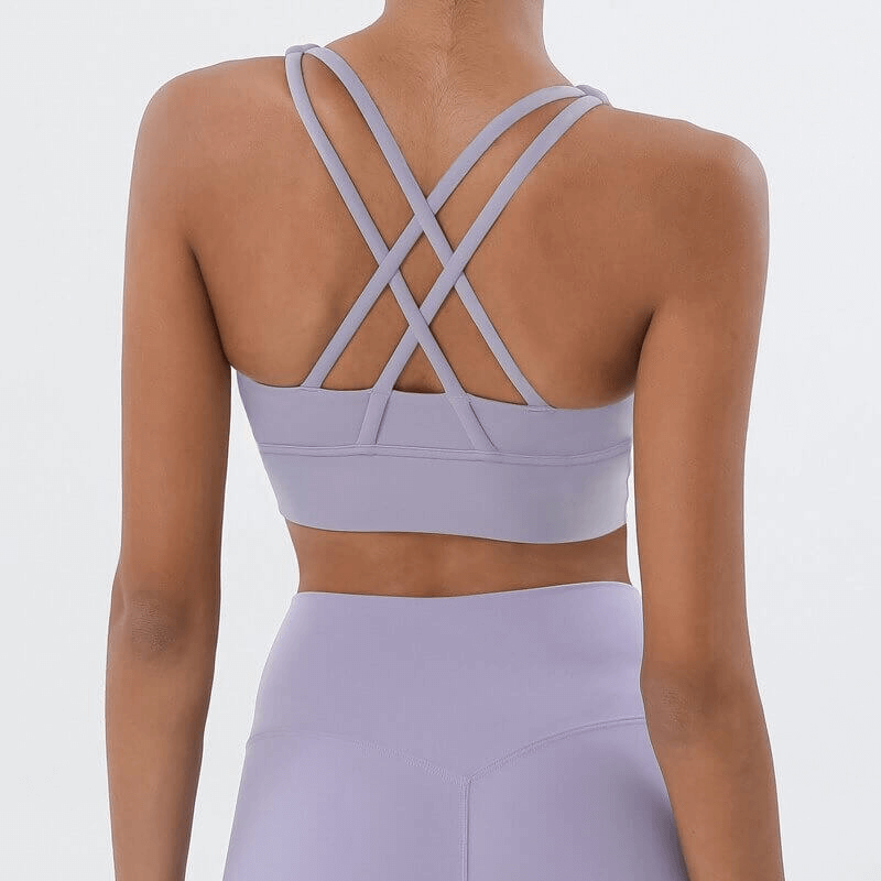 Back view of a purple nylon sports top with cross shoulder straps, perfect for yoga, gym, and fitness activities - SF0036.