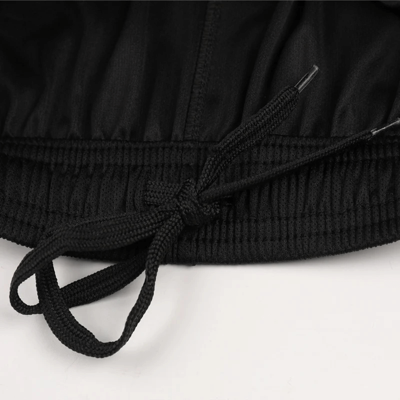 Close-up of black shorts with drawstring, part of the SF2038 athletic running set featuring durable polyester material for ultimate performance.