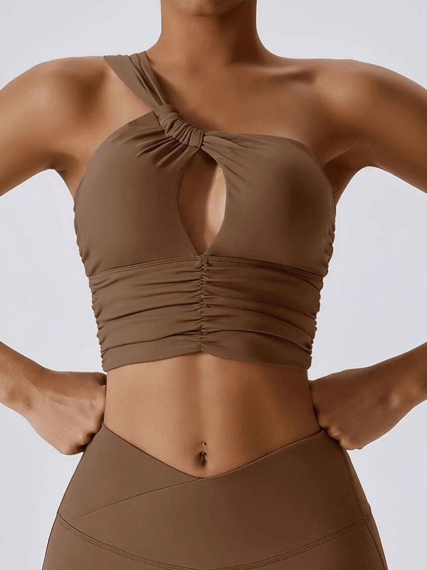 One Shoulder Backless Yoga Sports Bra in brown, designed for female athletes, offering breathability and support with nylon and spandex.