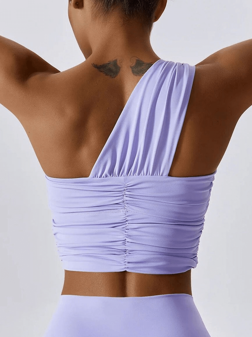 One Shoulder Backless Fitness Yoga Sports Bra in lavender, designed for female athletes, providing comfort and support with breathable fabric.