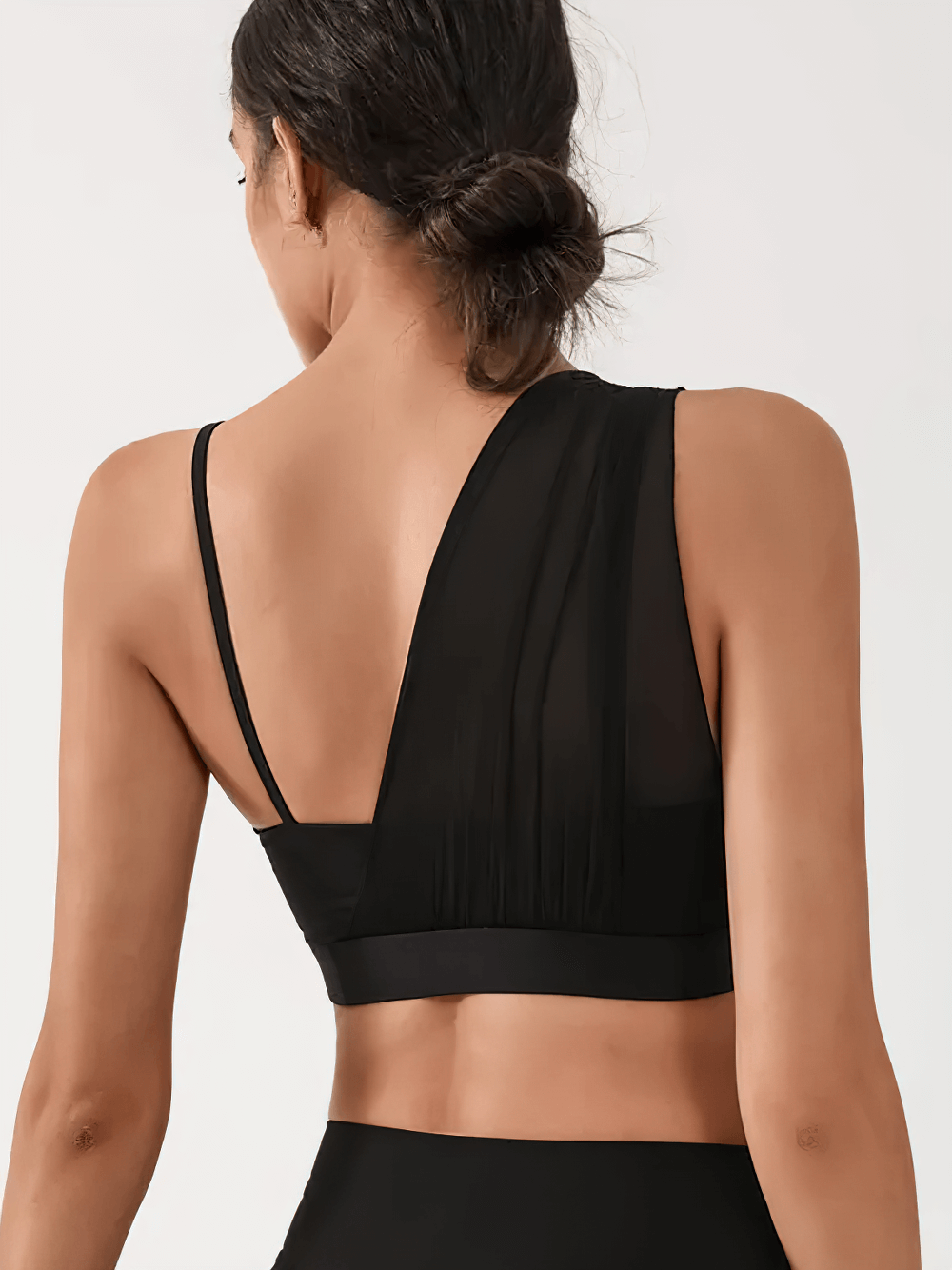 Back view of One-Shoulder Mesh Sports Bra with Supportive Band - SF4039 showing asymmetrical design and stretchy elastic band.