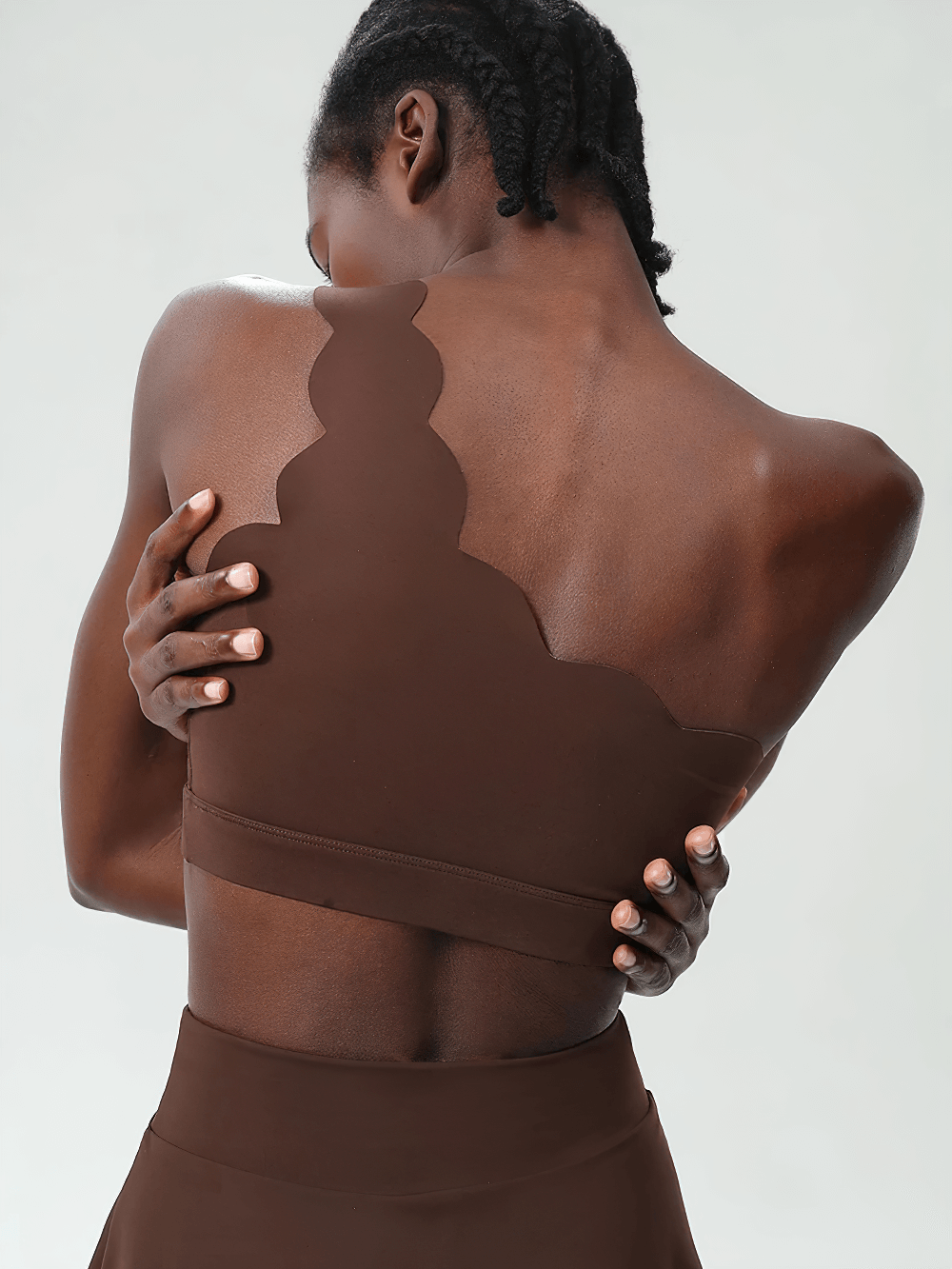 Back view of One-Shoulder Scallop Seamless Yoga Sports Bra - SF4012, showing scalloped design and asymmetrical strap.