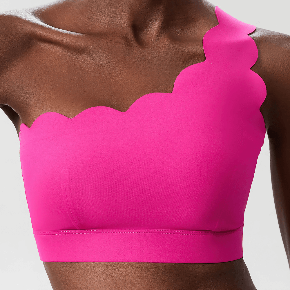 One-Shoulder Scallop Seamless Yoga Sports Bra - SF4012 in vibrant pink with unique scalloped edges, perfect for active and casual wear.