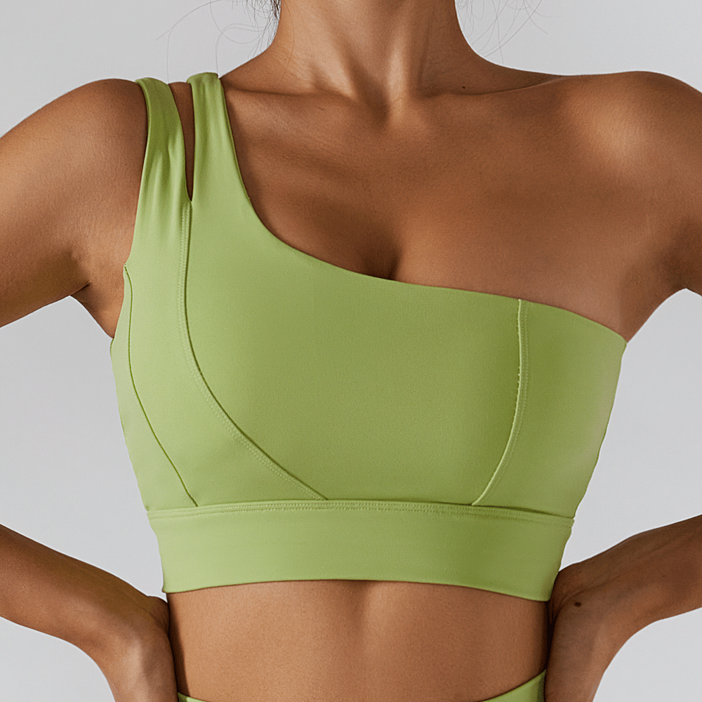 Stylish one-shoulder green sports bra for women, featuring a push-up design and breathable fabric, perfect for yoga and workouts.