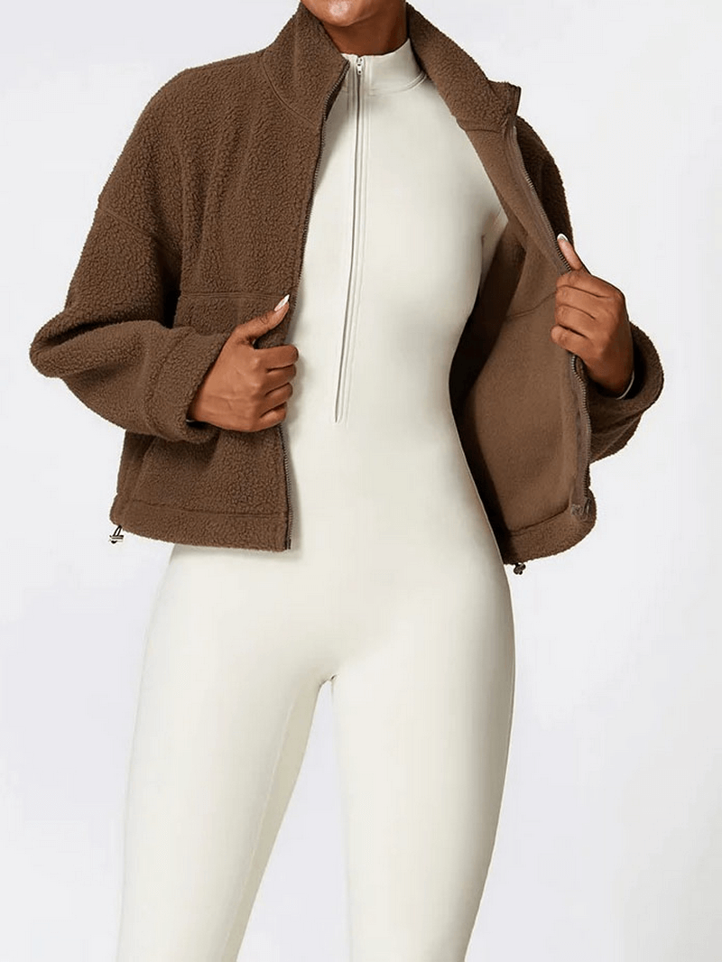 Woman wearing brown Outdoor Long Sleeves Zipper Sports Fleece Jacket SF1826, ideal for yoga and outdoor activities.