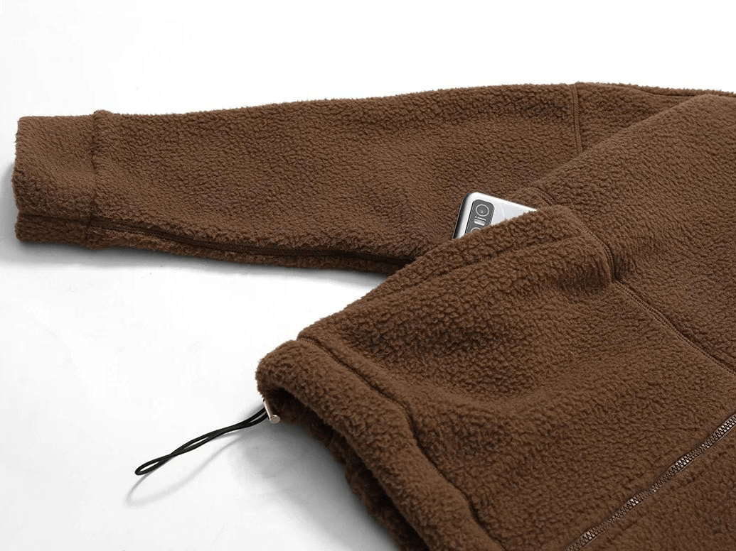 Brown fleece jacket with zipper and pocket detail, ideal for outdoor sports and yoga. Soft, durable fabric for active women. Model SF1826.